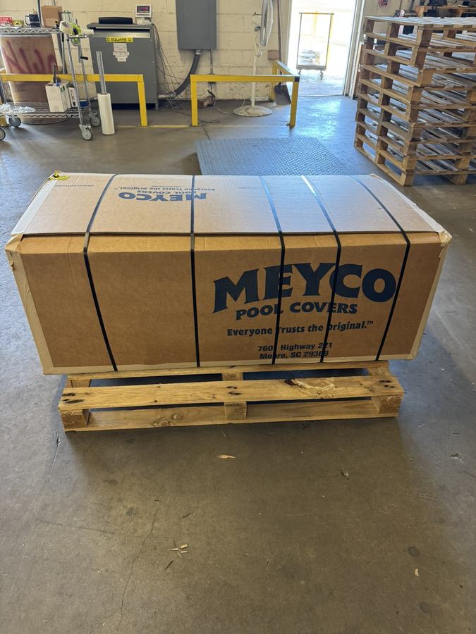 A boxed Meyco cover on a pallet, ready to be delivered.